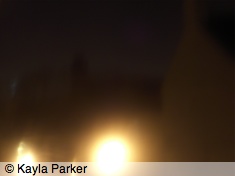 Kayla's photo of the new moon, just visible above rooftops