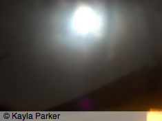 photo of full moon rising over JL's roof, hand-held from boiler room window
